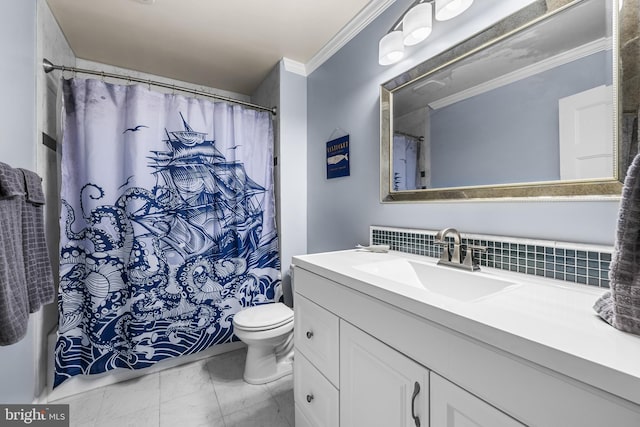 bathroom with tasteful backsplash, crown molding, vanity, and toilet