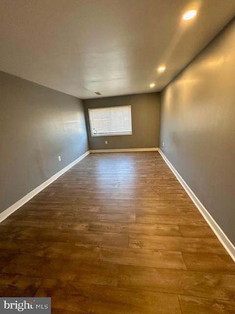 spare room with hardwood / wood-style floors