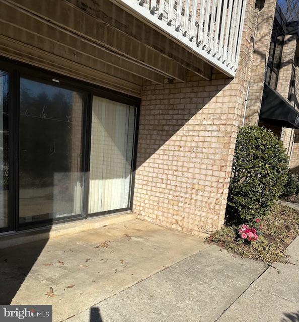 entrance to property featuring a patio area