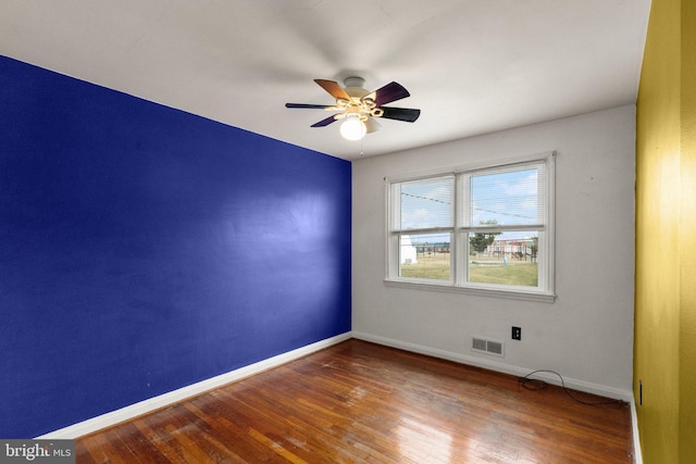 spare room with ceiling fan and hardwood / wood-style floors