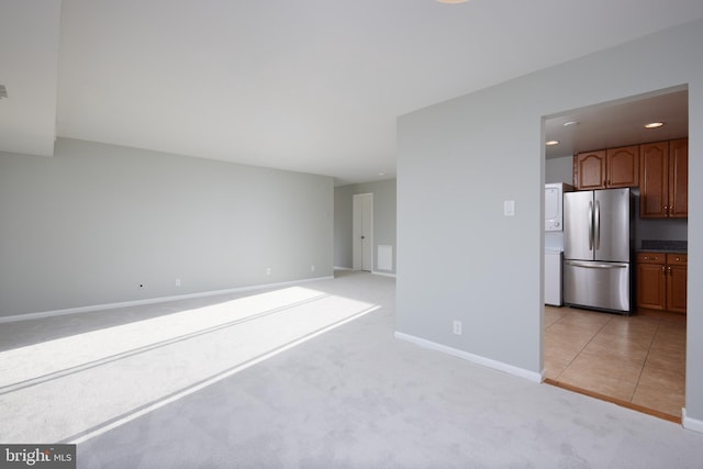 interior space featuring light colored carpet