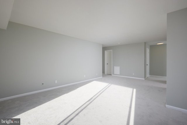 empty room featuring light carpet