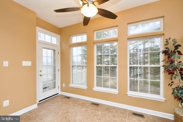 entryway featuring ceiling fan