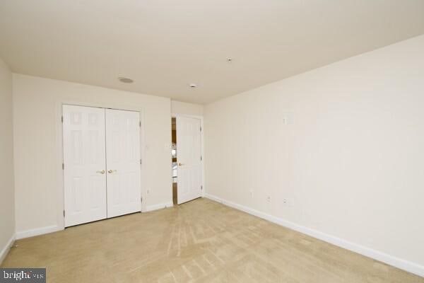 unfurnished bedroom featuring a closet