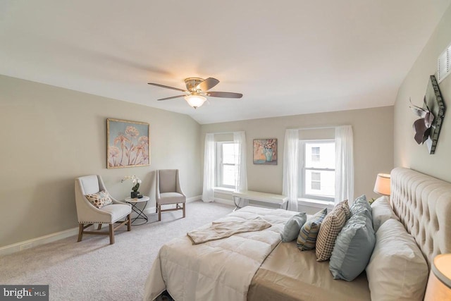 bedroom featuring ceiling fan, baseboards, and light colored carpet