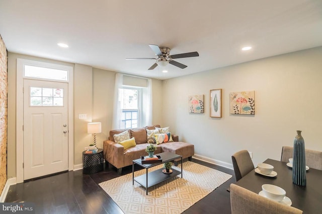 living area with recessed lighting, baseboards, and wood finished floors