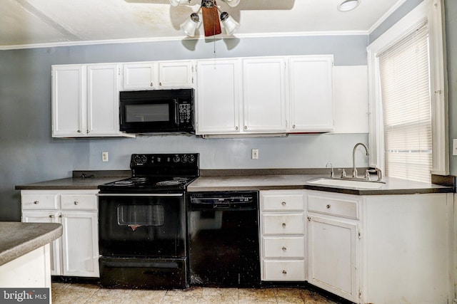 kitchen featuring crown molding, white cabinets, sink, and black appliances