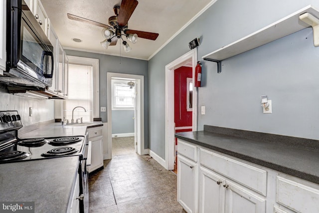 kitchen featuring sink, white cabinetry, crown molding, electric range oven, and ceiling fan