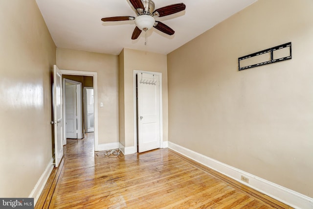 unfurnished bedroom featuring ceiling fan and light hardwood / wood-style flooring