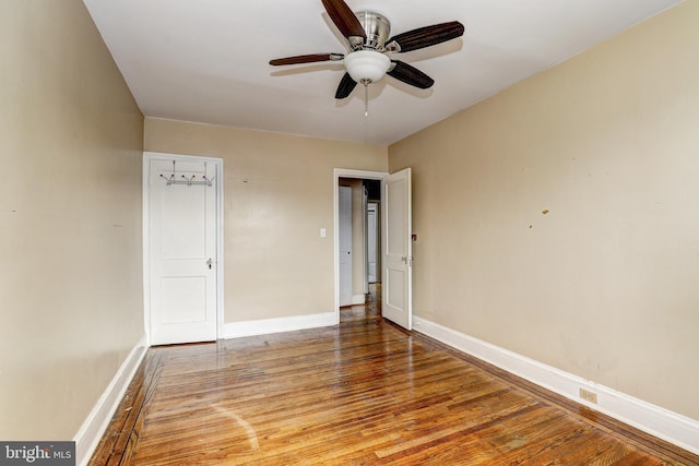 unfurnished bedroom featuring hardwood / wood-style flooring and ceiling fan