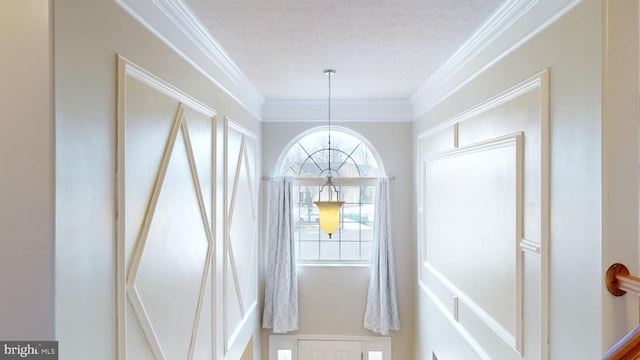 interior space with crown molding and an inviting chandelier