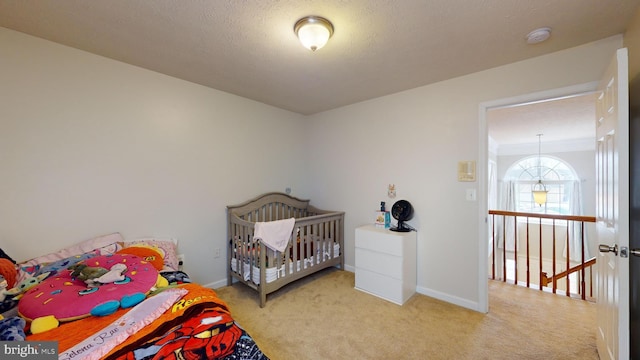 bedroom featuring light carpet