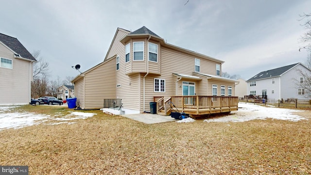 back of property featuring a yard, a patio area, and a deck