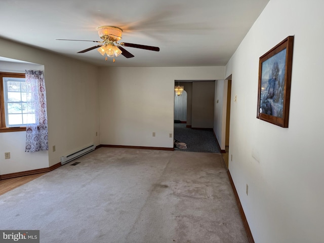 spare room with a baseboard radiator, light colored carpet, and ceiling fan