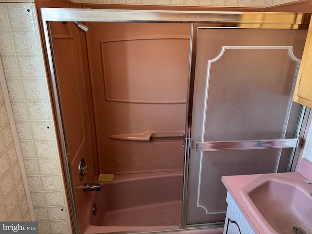 bathroom featuring vanity and washtub / shower combination