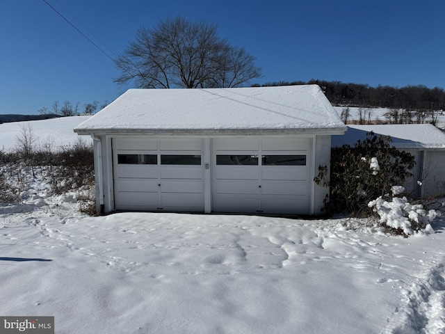 view of snow covered garage