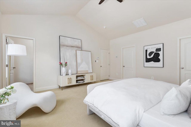 carpeted bedroom featuring lofted ceiling and ceiling fan