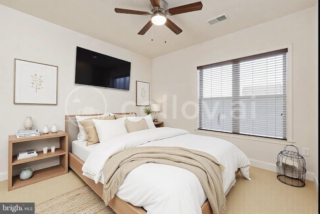 carpeted bedroom featuring ceiling fan