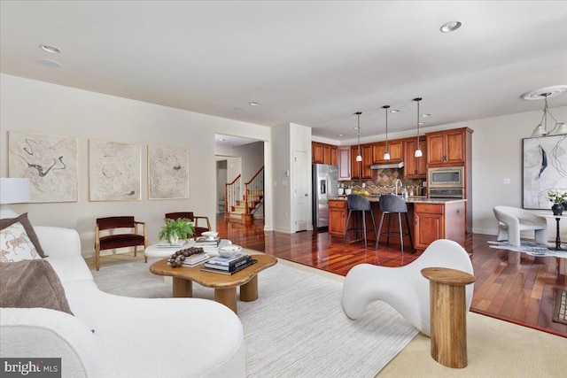 living room with dark hardwood / wood-style floors