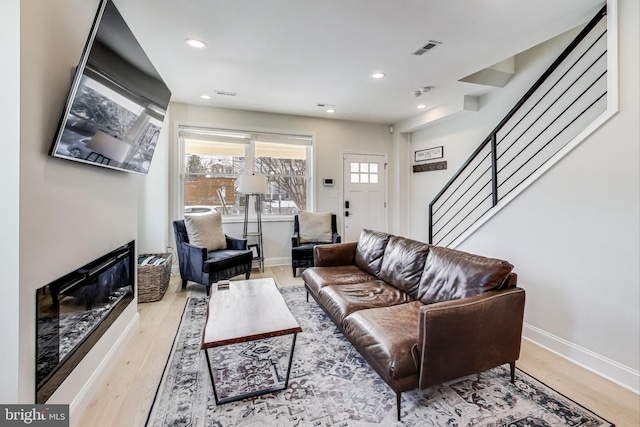 living room with light hardwood / wood-style floors