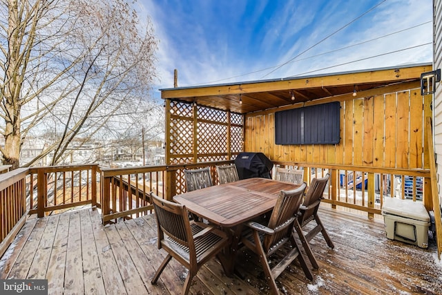 snow covered deck with area for grilling