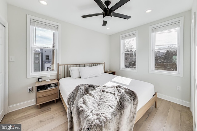 bedroom featuring light hardwood / wood-style flooring and ceiling fan