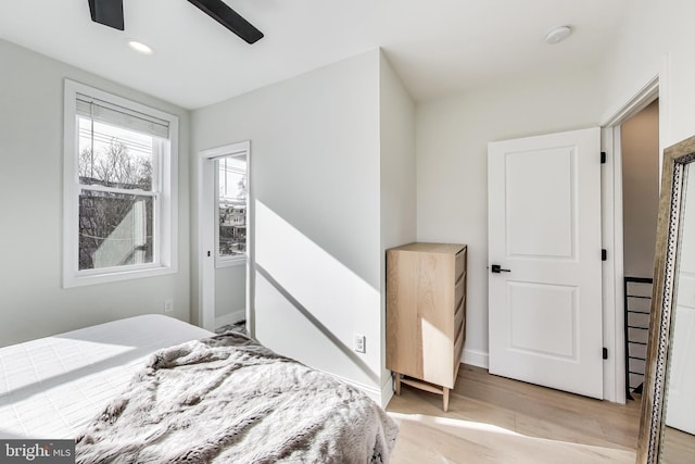 bedroom featuring ceiling fan and light hardwood / wood-style floors