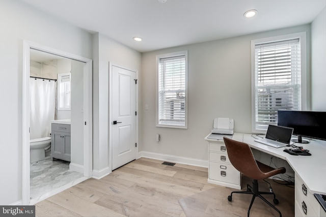 office with light hardwood / wood-style flooring