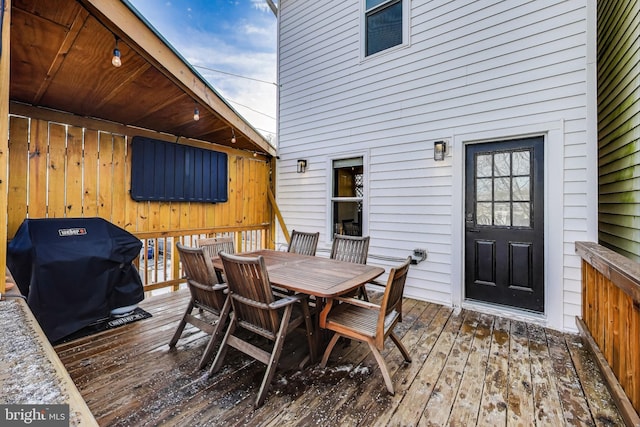 wooden terrace featuring grilling area