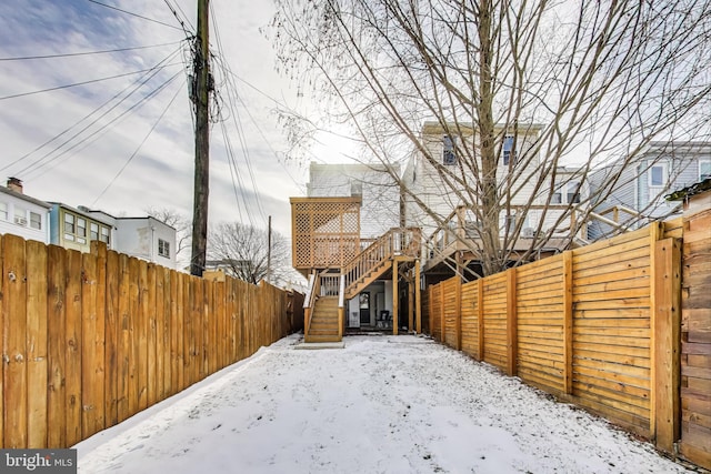 view of yard layered in snow