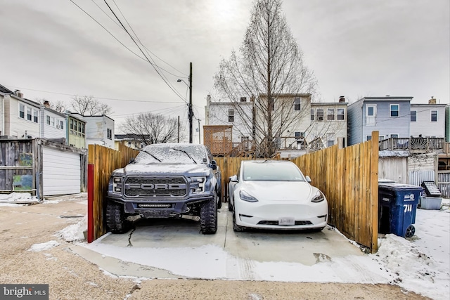 view of snow covered parking