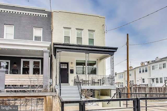 multi unit property featuring a porch