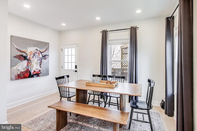 dining area with light hardwood / wood-style flooring