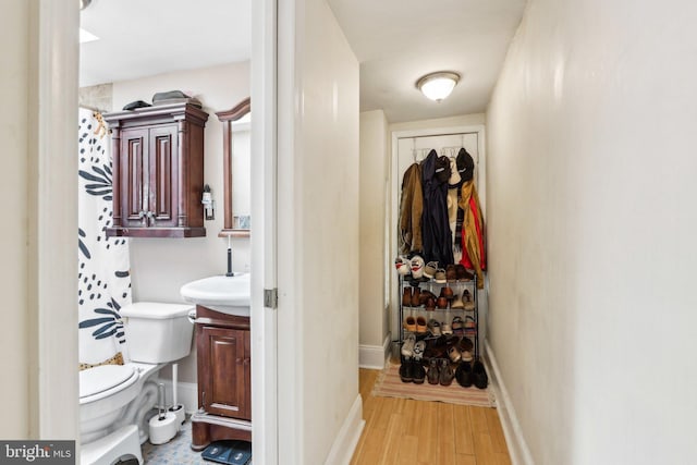 interior space with sink and light hardwood / wood-style floors