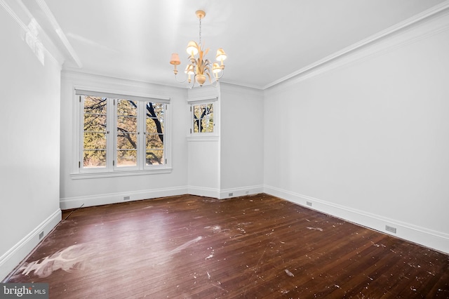 unfurnished dining area with crown molding, dark wood-type flooring, and a chandelier