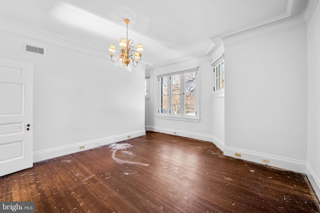 unfurnished room featuring crown molding, dark wood-type flooring, and an inviting chandelier