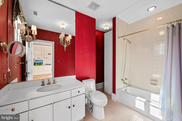 full bathroom with tile patterned flooring, vanity, shower / tub combo, and toilet