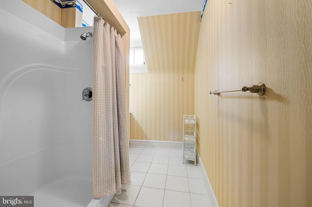 bathroom featuring a shower with curtain and tile patterned flooring