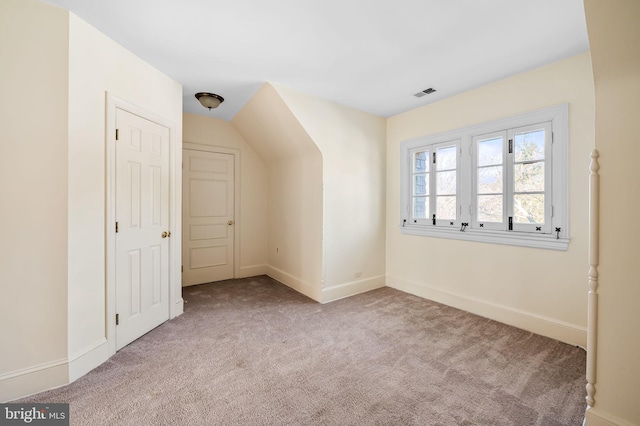 additional living space with light colored carpet