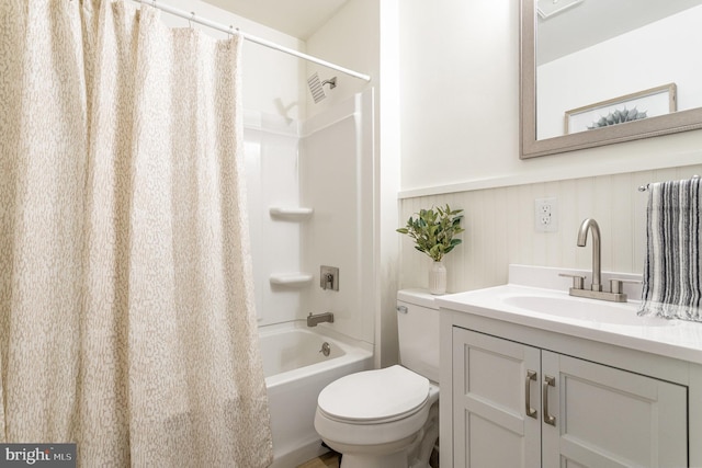 full bathroom with shower / bathtub combination with curtain, vanity, and toilet