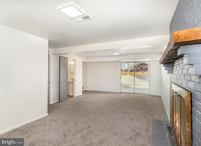 unfurnished living room featuring a fireplace and carpet floors