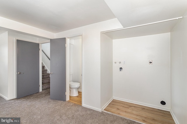 washroom with carpet floors and hookup for an electric dryer