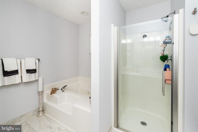 bathroom with separate shower and tub