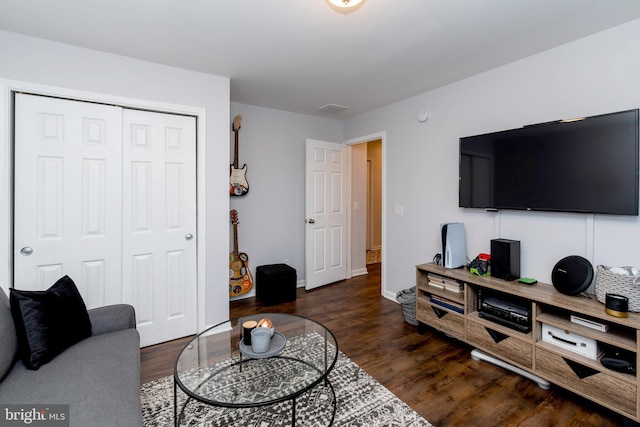 living room with dark hardwood / wood-style flooring