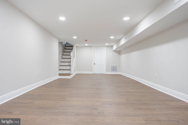 basement featuring light wood-type flooring