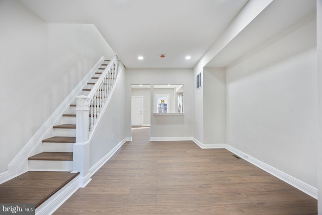 stairway with wood-type flooring