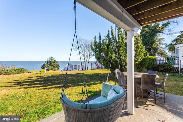 view of patio with a water view