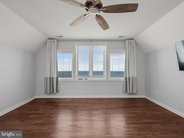 additional living space featuring vaulted ceiling, ceiling fan, and dark hardwood / wood-style flooring