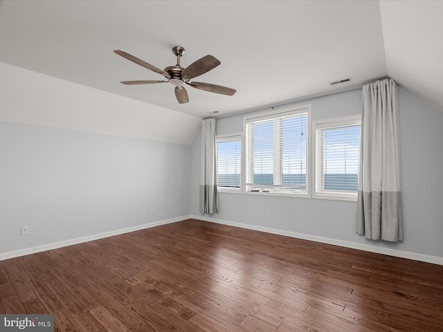 additional living space featuring dark hardwood / wood-style flooring, lofted ceiling, and ceiling fan