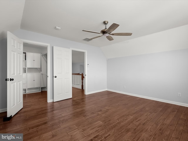 additional living space with ceiling fan, lofted ceiling, and dark hardwood / wood-style flooring